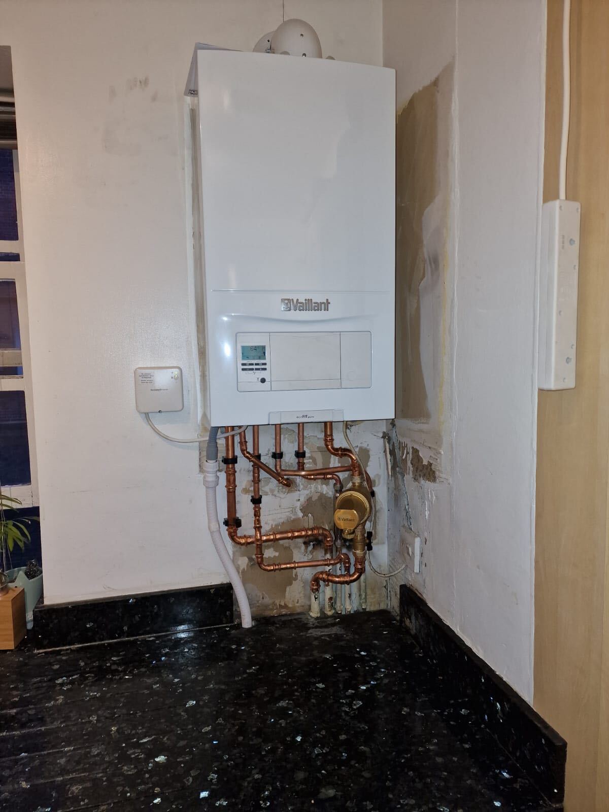 Vaillant ecoFIT pure boiler fitted in a kitchen corner with copper pipework and wireless room thermostat, Ealing and West London, The Bearded Property Co, 020 8050 9389